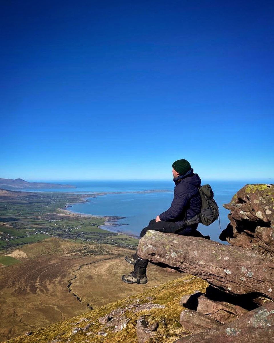 Rob Condon resting on a high Kerry mountainside above the Atlantic coast