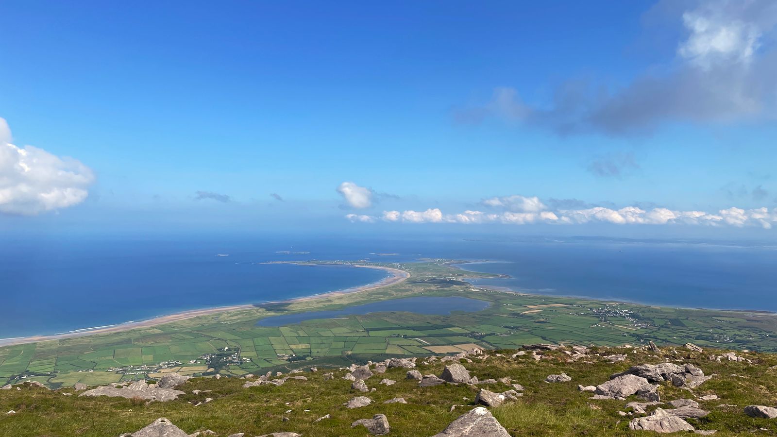 A wide view from Beenoskee across Brandon Bay, the Maharees and the Atlantic