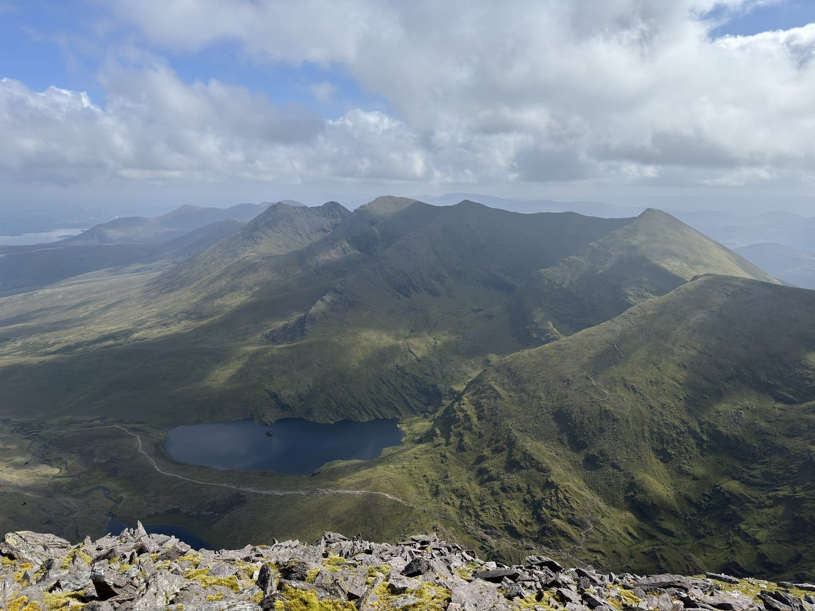 High panoramic view across the MacGillycuddy’s Reeks and mountain lakes