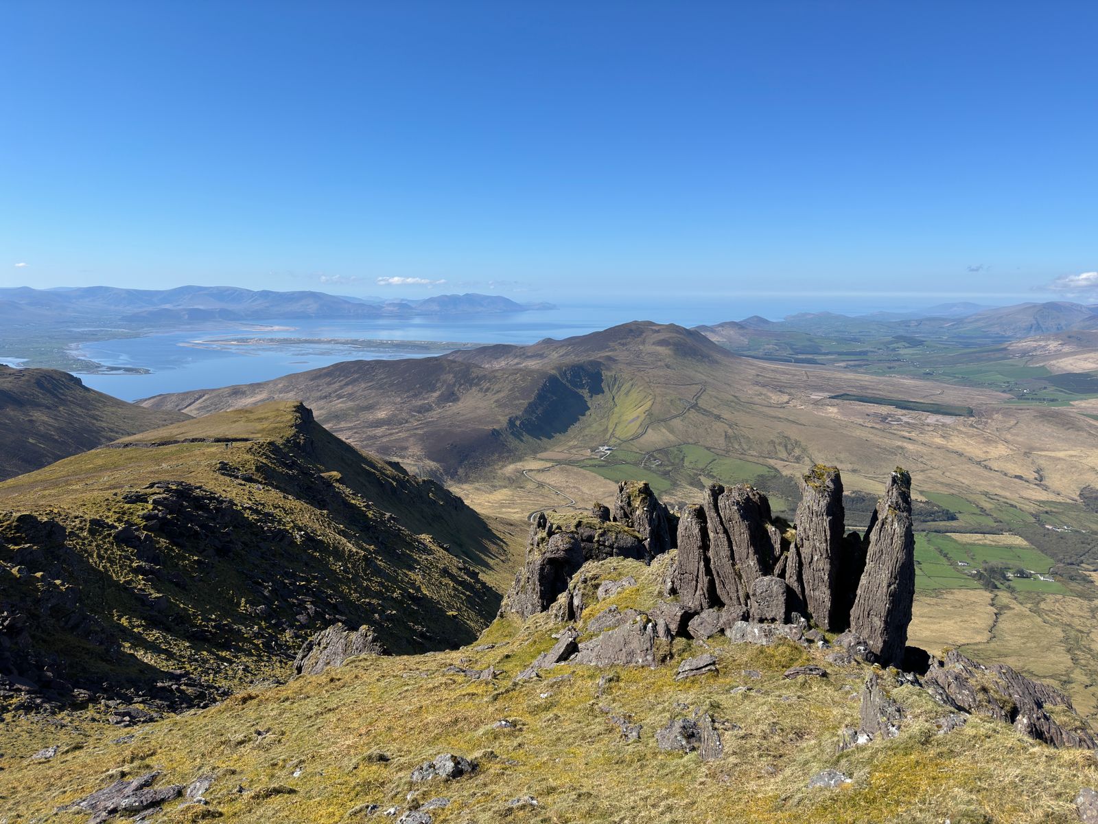 A line of dark sandstone towers overlooking Doire Mór