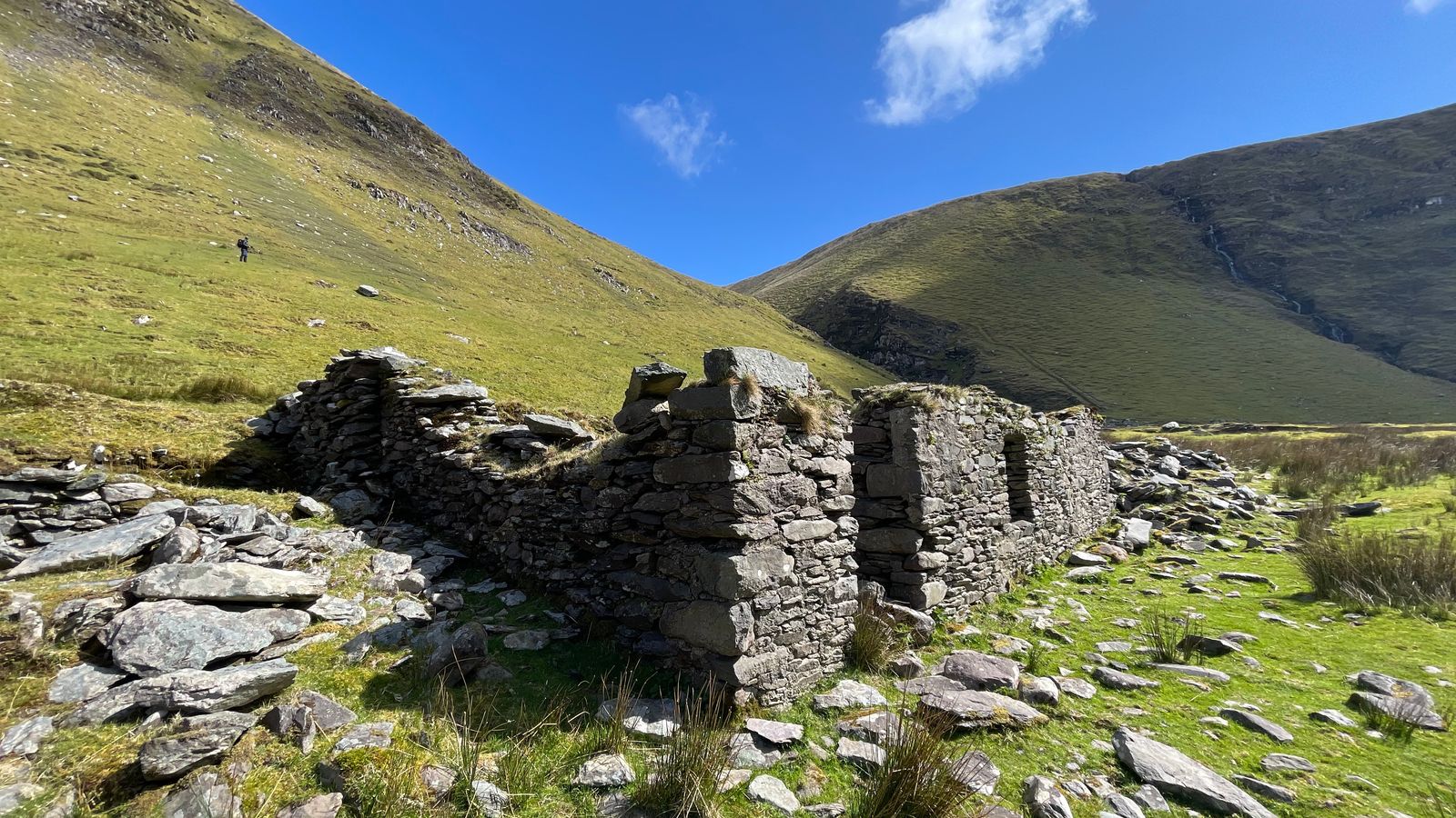 The roofless stone walls of Mary Macha na Bó O’Donnell’s former house on the valley floor