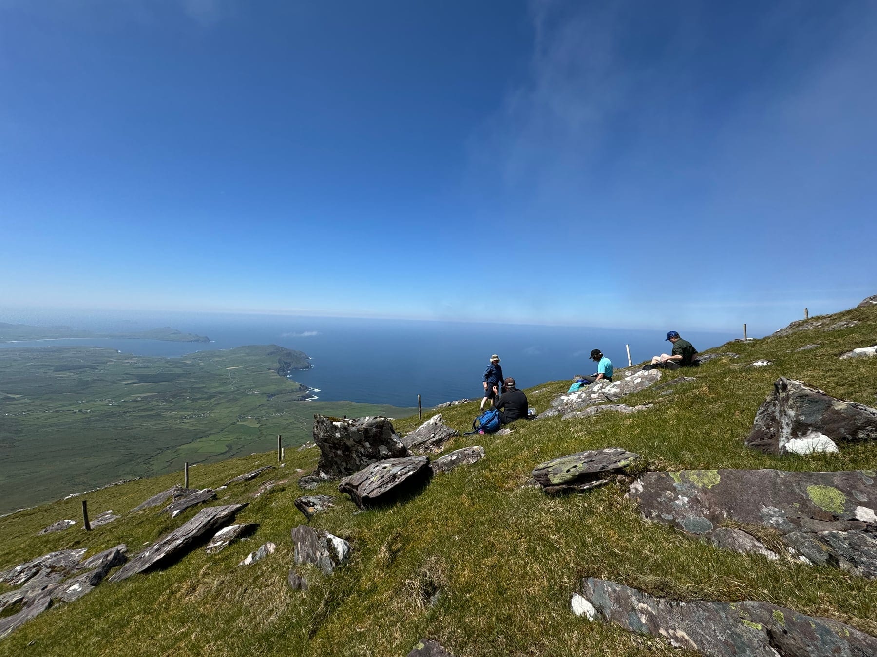 Walkers resting high above the Atlantic on Mount Brandon