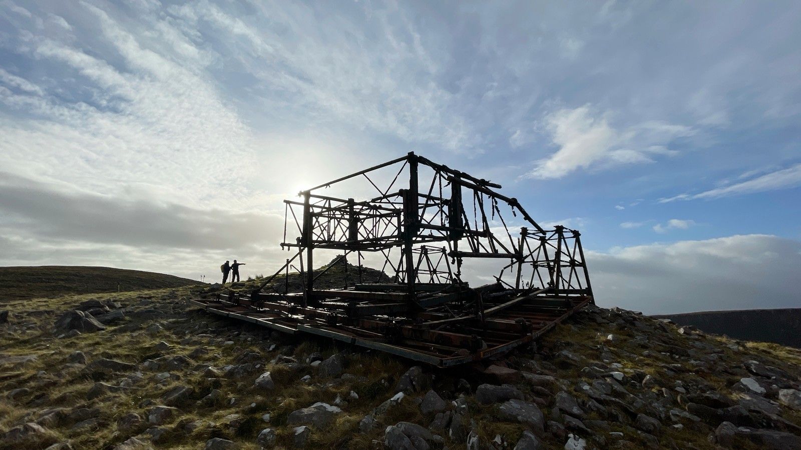 The Iron Man structure silhouetted beneath a dramatic Kerry sky
